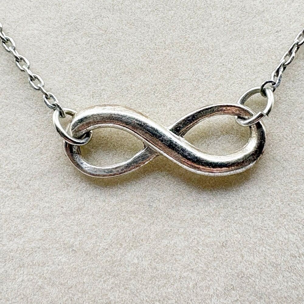 2009 Avon Empowerment Infinity Pendant Necklace Silver Tone Extender Chain 19”